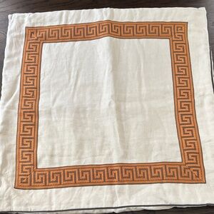 Custom pillow sham with cream, brown, and orange. 25” square.